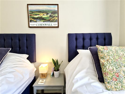 twin headboards and picture of cornwall